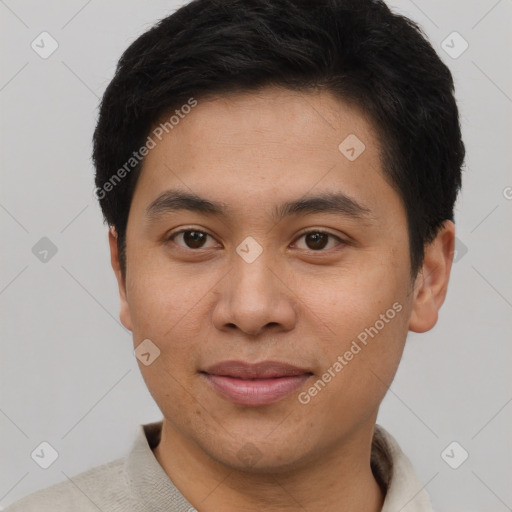 Joyful asian young-adult male with short  brown hair and brown eyes