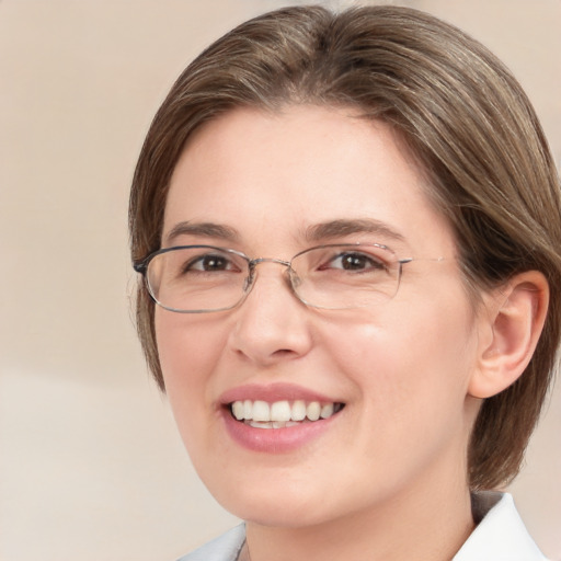 Joyful white adult female with medium  brown hair and brown eyes