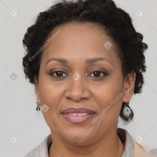 Joyful black adult female with short  brown hair and brown eyes