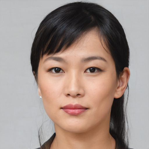 Neutral asian young-adult female with medium  black hair and brown eyes