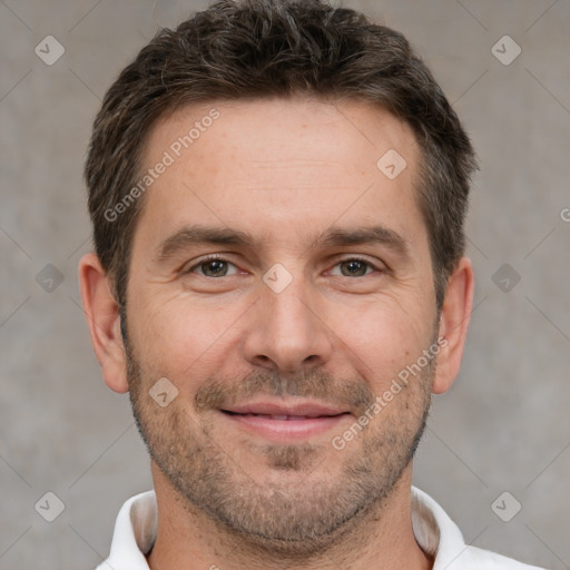 Joyful white adult male with short  brown hair and brown eyes