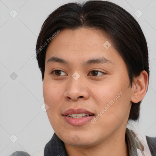 Joyful asian young-adult female with medium  brown hair and brown eyes