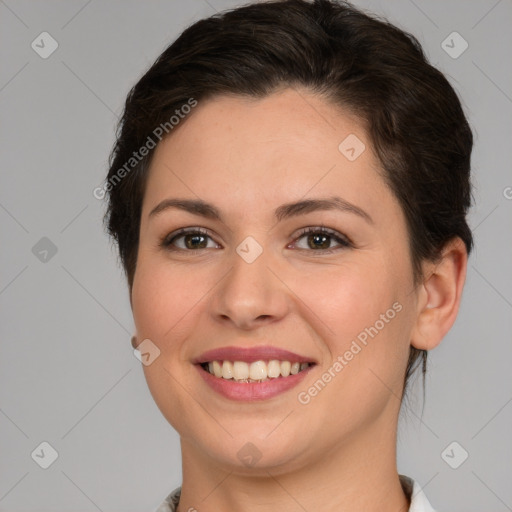 Joyful white young-adult female with short  brown hair and brown eyes