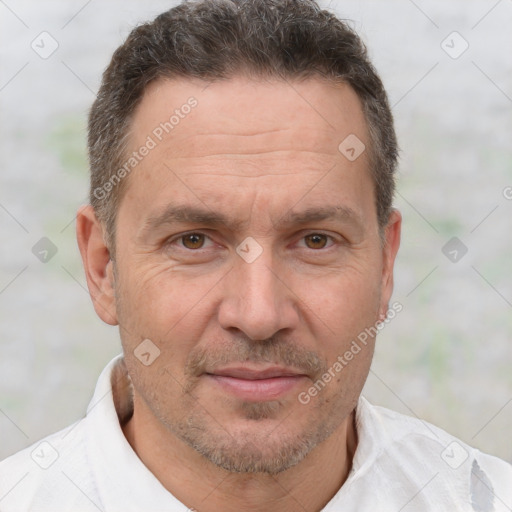 Joyful white adult male with short  brown hair and brown eyes