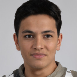 Joyful asian young-adult male with short  black hair and brown eyes