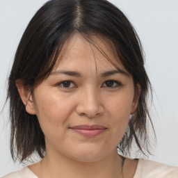 Joyful white adult female with medium  brown hair and brown eyes