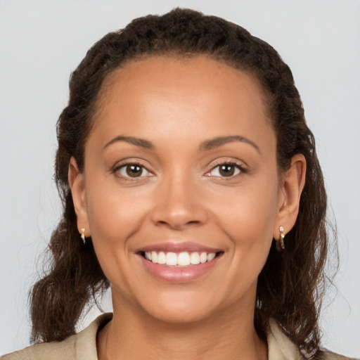 Joyful white young-adult female with medium  brown hair and brown eyes