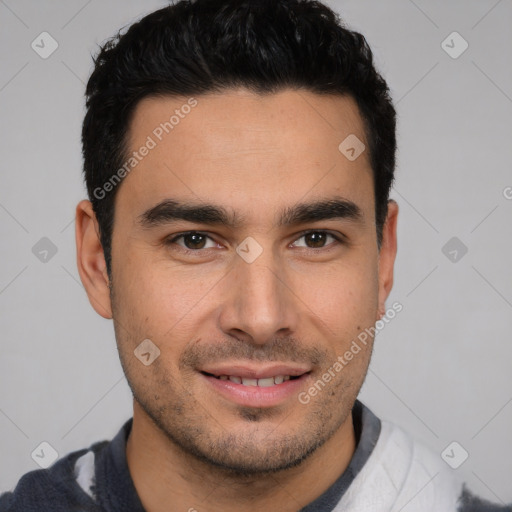 Joyful white young-adult male with short  black hair and brown eyes