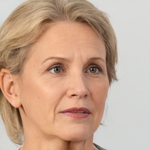 Joyful white middle-aged female with medium  brown hair and brown eyes