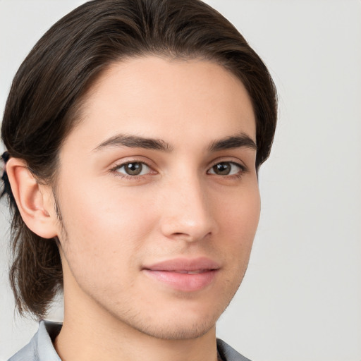 Joyful white young-adult male with medium  brown hair and brown eyes