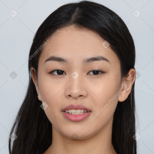 Joyful asian young-adult female with long  black hair and brown eyes