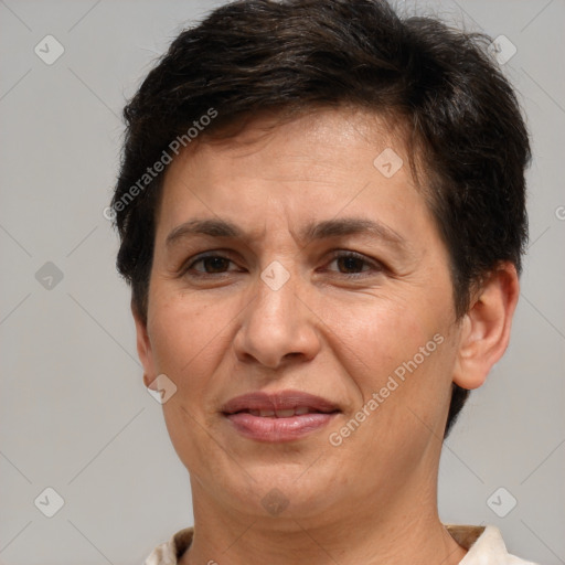 Joyful white adult female with short  brown hair and brown eyes