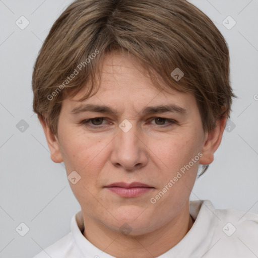 Joyful white adult female with short  brown hair and grey eyes