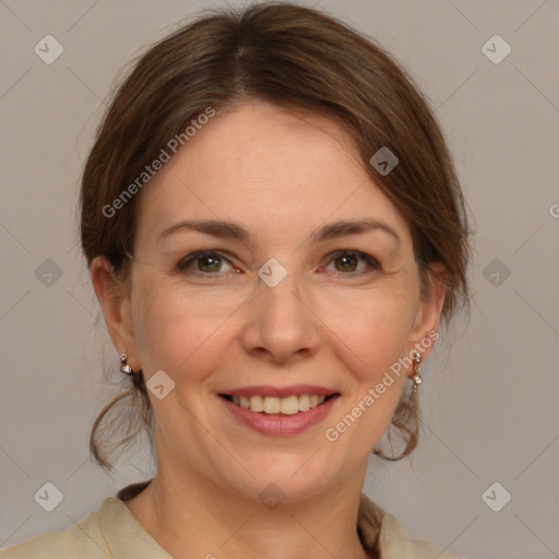 Joyful white adult female with medium  brown hair and grey eyes