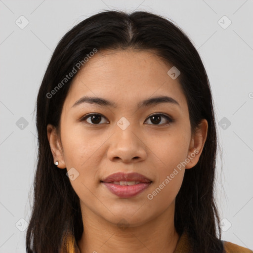 Joyful latino young-adult female with long  brown hair and brown eyes