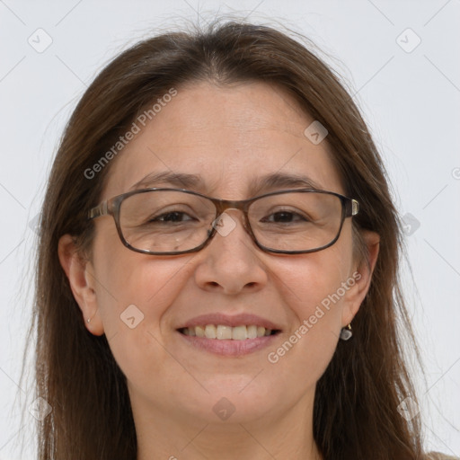 Joyful white adult female with long  brown hair and brown eyes