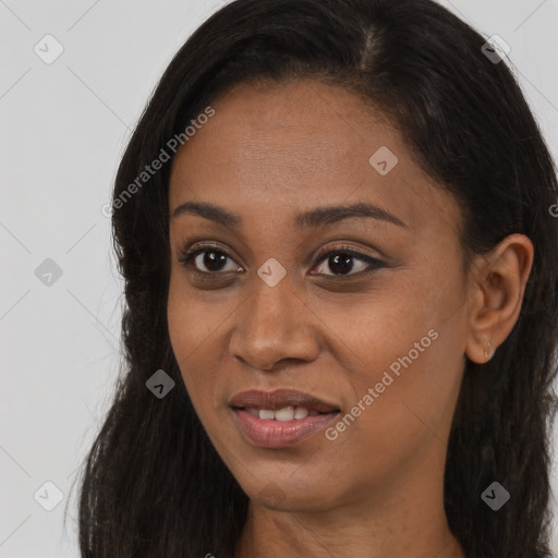 Joyful black young-adult female with long  brown hair and brown eyes