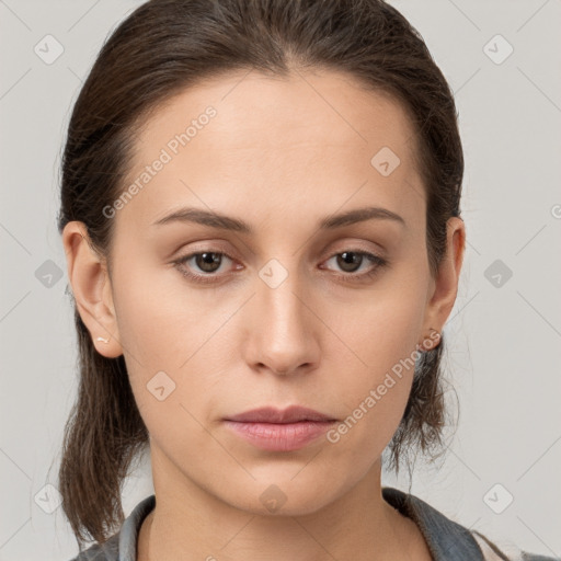 Neutral white young-adult female with medium  brown hair and brown eyes