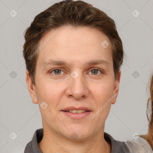 Joyful white adult male with short  brown hair and grey eyes