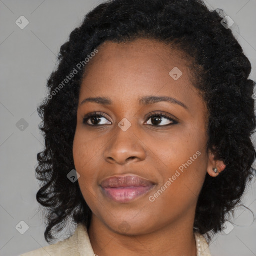 Joyful black young-adult female with medium  black hair and brown eyes