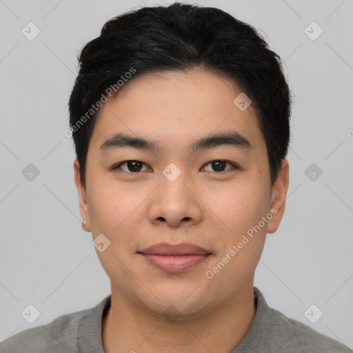 Joyful asian young-adult male with short  black hair and brown eyes