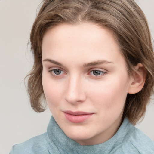 Joyful white young-adult female with medium  brown hair and blue eyes