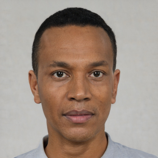 Neutral black adult male with short  black hair and brown eyes