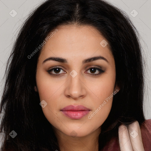 Joyful latino young-adult female with long  black hair and brown eyes