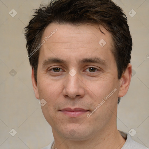 Joyful white adult male with short  brown hair and brown eyes