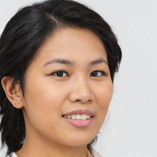 Joyful asian young-adult female with medium  brown hair and brown eyes