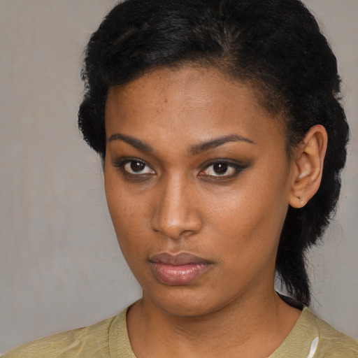 Neutral black young-adult female with medium  black hair and brown eyes