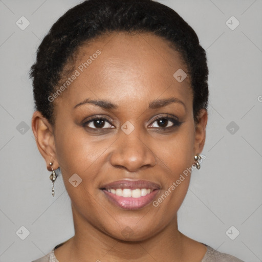 Joyful black young-adult female with short  black hair and brown eyes