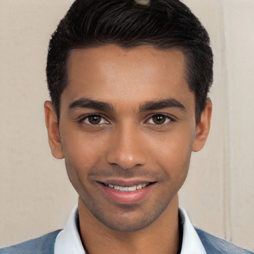 Joyful white young-adult male with short  black hair and brown eyes