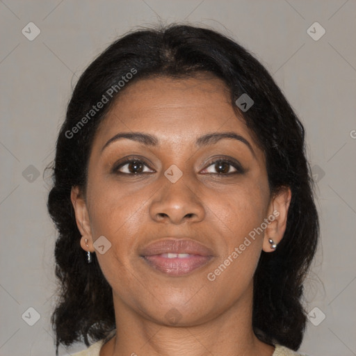 Joyful black adult female with medium  brown hair and brown eyes