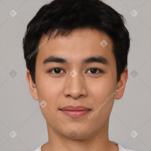 Joyful asian young-adult male with short  black hair and brown eyes