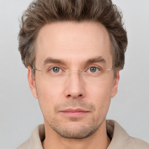 Neutral white adult male with short  brown hair and grey eyes