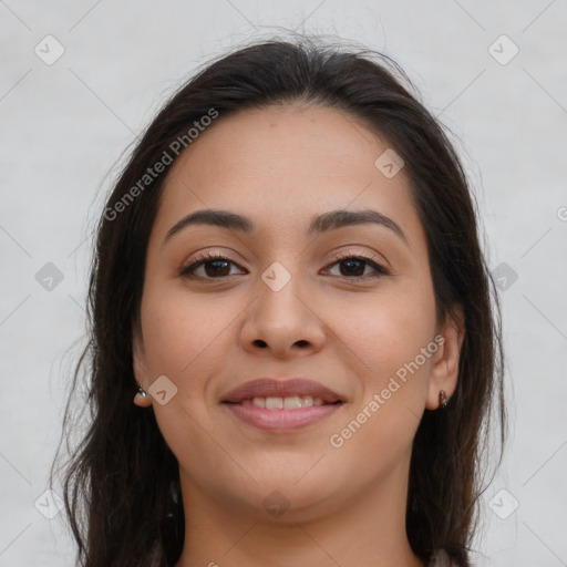 Joyful latino young-adult female with long  brown hair and brown eyes