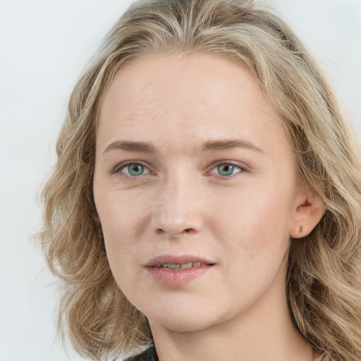 Joyful white young-adult female with long  brown hair and blue eyes