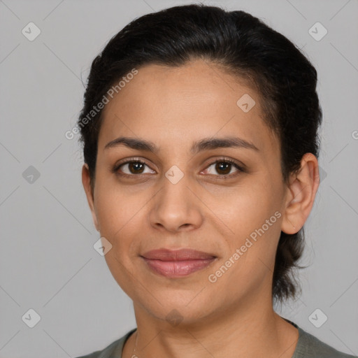 Joyful latino young-adult female with medium  brown hair and brown eyes