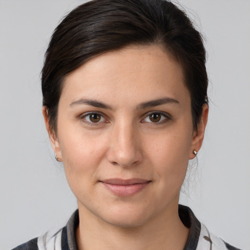 Joyful white young-adult female with medium  brown hair and brown eyes