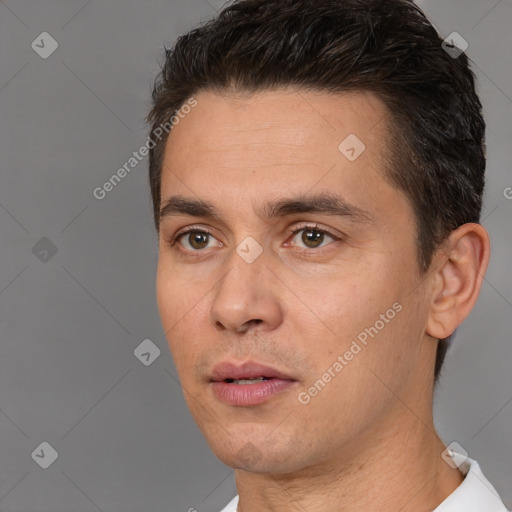 Joyful white young-adult male with short  brown hair and brown eyes