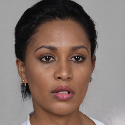 Neutral black young-adult female with short  black hair and brown eyes