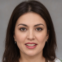 Joyful white young-adult female with medium  brown hair and brown eyes