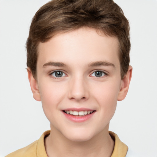 Joyful white child male with short  brown hair and brown eyes