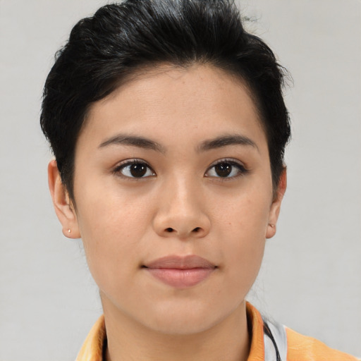 Joyful asian young-adult female with short  brown hair and brown eyes