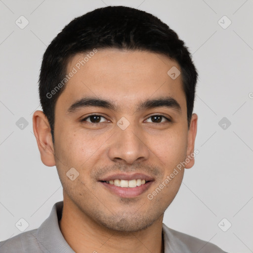 Joyful latino young-adult male with short  black hair and brown eyes