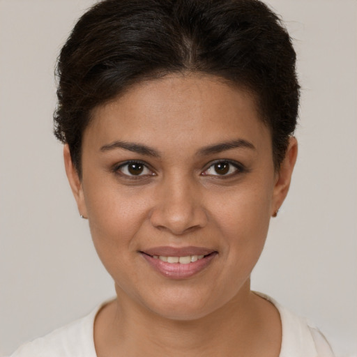 Joyful white young-adult female with short  brown hair and brown eyes