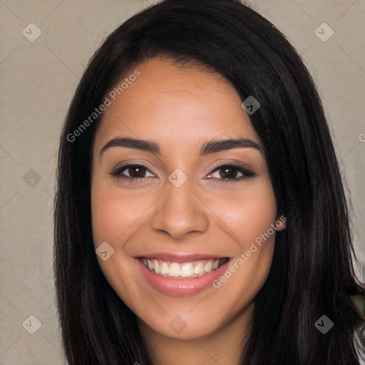 Joyful latino young-adult female with long  black hair and brown eyes