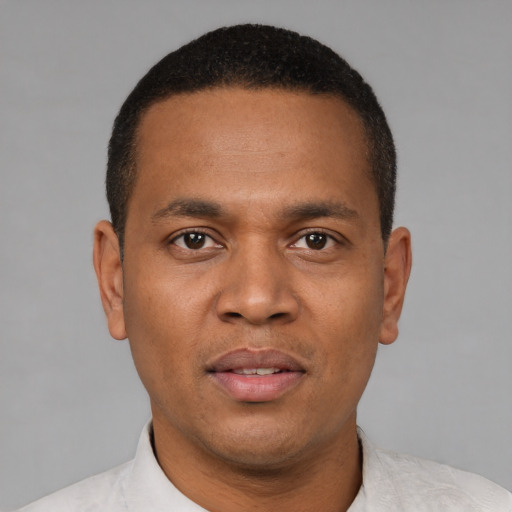 Neutral latino young-adult male with short  brown hair and brown eyes