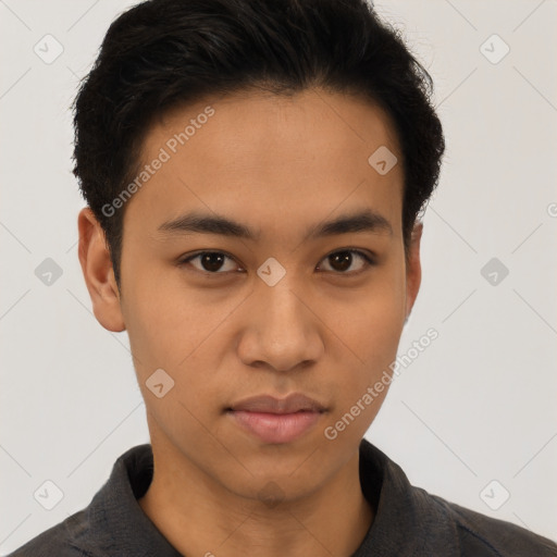 Joyful latino young-adult male with short  brown hair and brown eyes